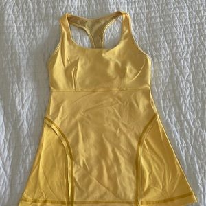 Lululemon sunshine yellow tank with bra insert (padding not included).